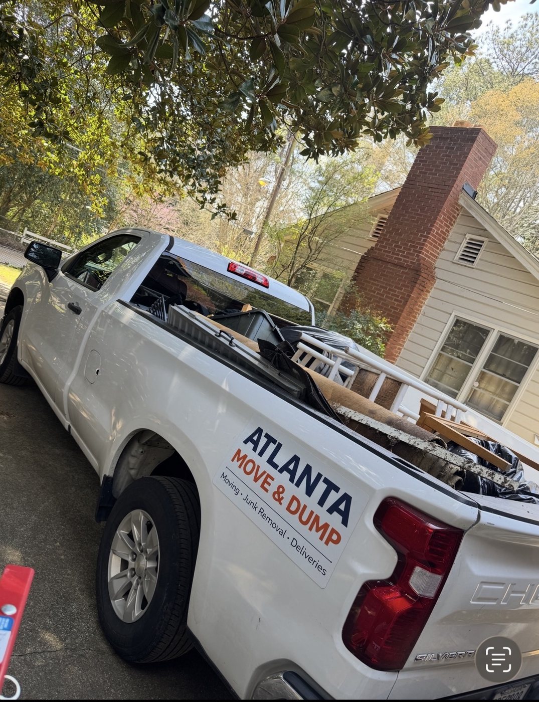 Atlanta Move & Dump truck with company logo